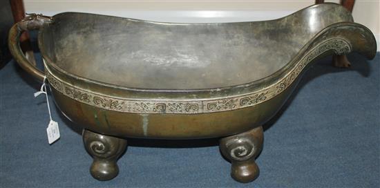 A large Chinese bronze pouring vessel, Yi, 17th / 18th century, length 74.5cm